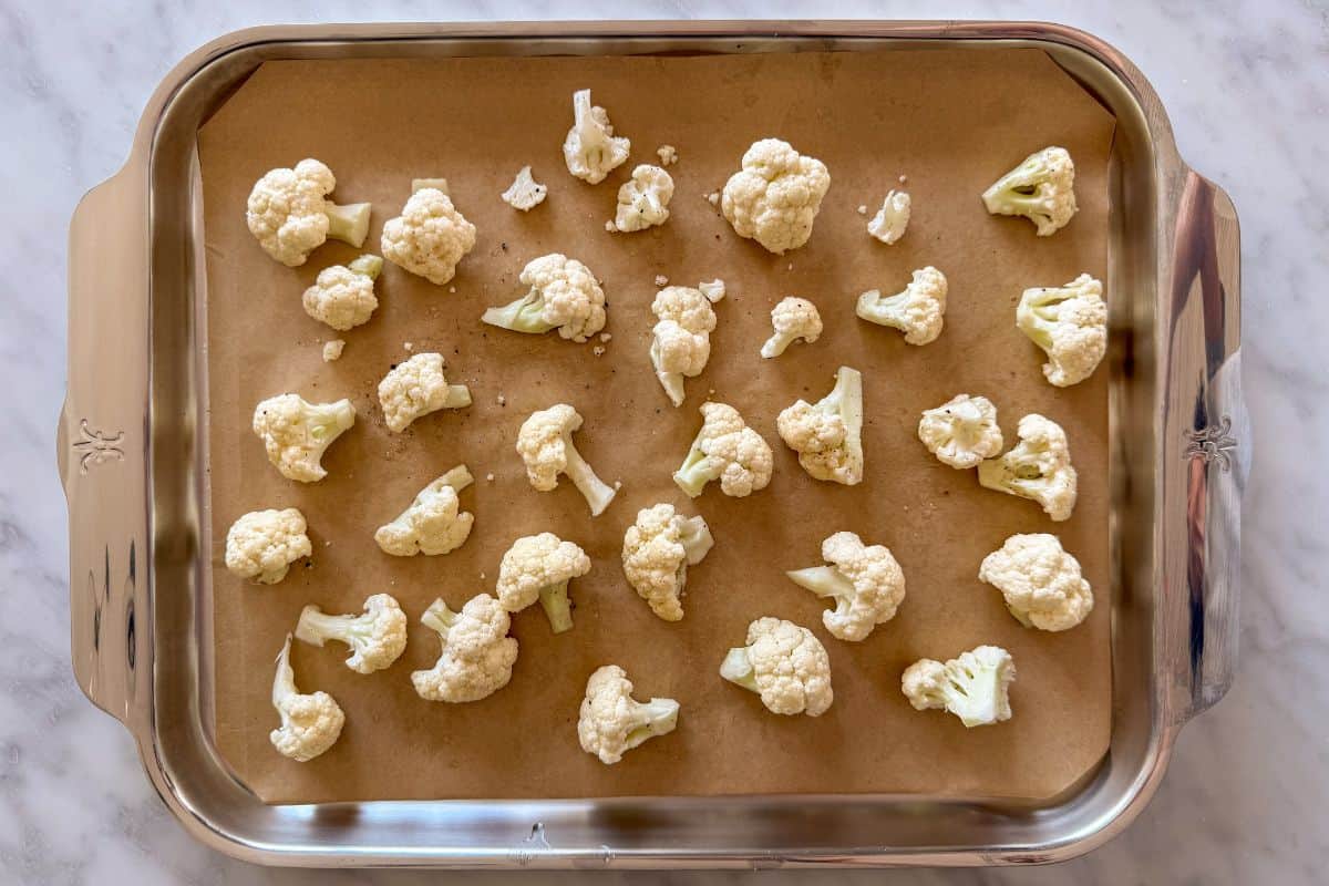Place the cauliflower florets on a parchment-lined sheet pan.