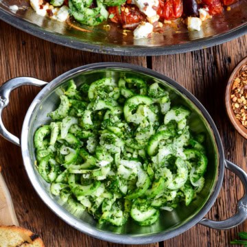 A crunchy cucumber and celery slaw with an herb dressing served in a mini au gratin.