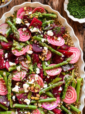 A colourful spring beet and lentil salad. Loaded with crisp asparagus, candy cane beets and feta.