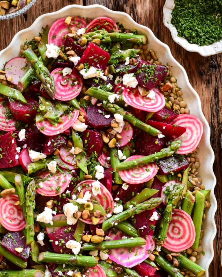 A colourful spring beet and lentil salad. Loaded with crisp asparagus, candy cane beets and feta.