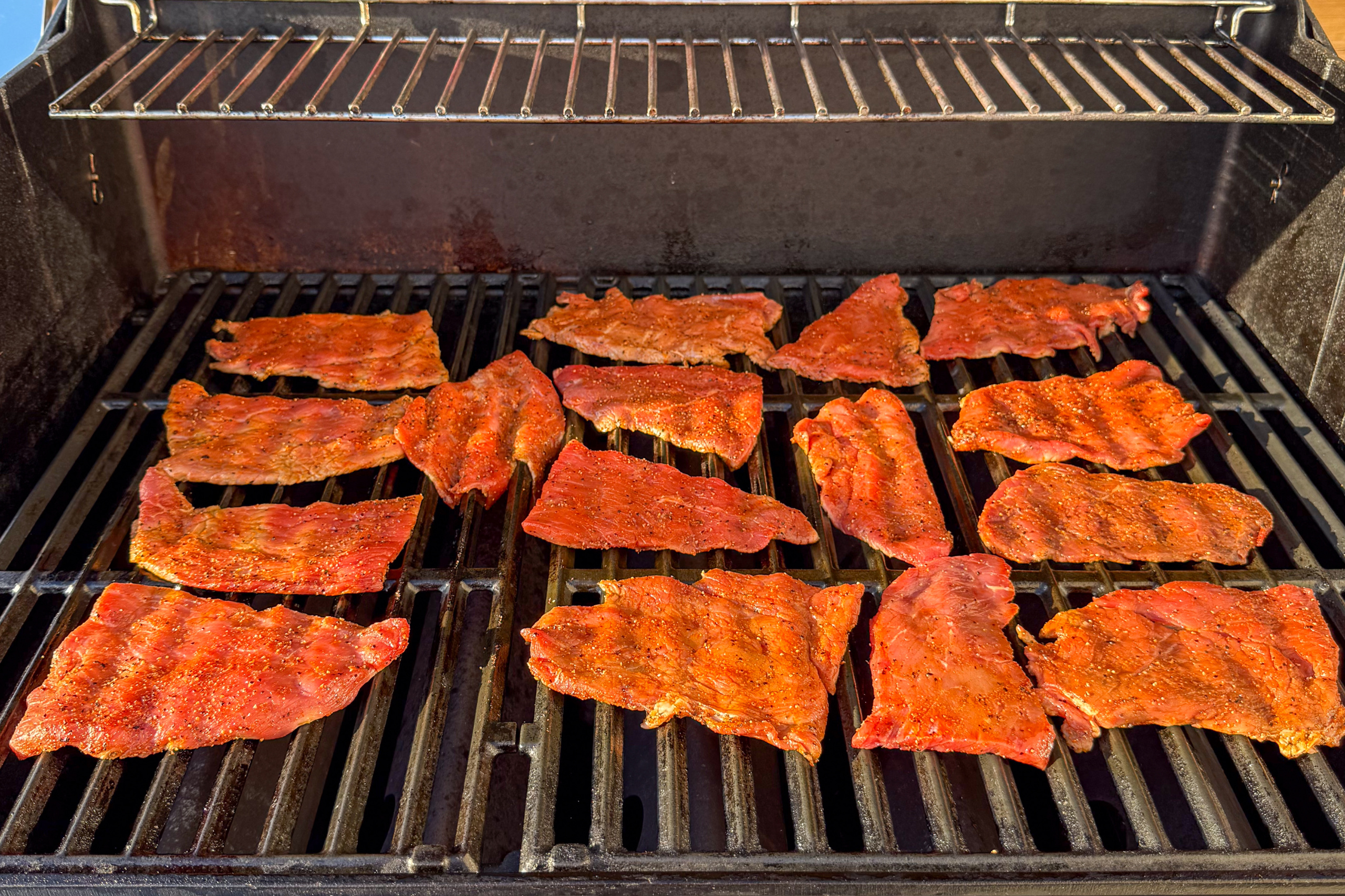 Place the veal cutlet halves on the grill for sandwiches.